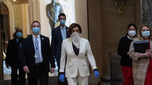 Nancy Pelosi with scarf as mask